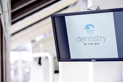 monitor displaying the Dentistry by the Bay logo