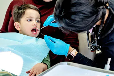 young child getting a dental cleaning at Dentistry by the Bay