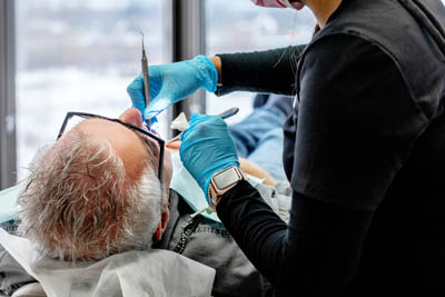 patient receiving a dental bridge at Dentistry by the Bay